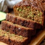 Moist, delicious zucchini bread sliced to reveal tender, green zucchini chunks and rich crust, perfect for breakfast or snacks, showcasing fresh bakery quality zucchini bread from The Bakers Whisk.