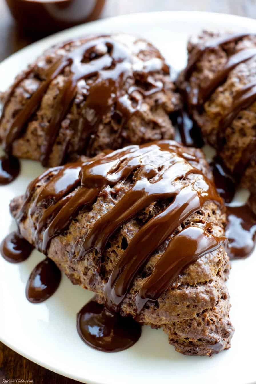 Decadent chocolate croissants drizzled with rich chocolate sauce, showcasing flaky layers and gooey chocolate filling, perfect for breakfast or dessert.