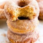 Freshly baked cinnamon sugar donuts with a crispy exterior and soft, fluffy interior covered in cinnamon sugar, perfect for breakfast or a sweet snack.